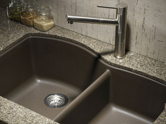 dark double kitchen sink with brushed stailess kitchen sink faucet and marble countertop