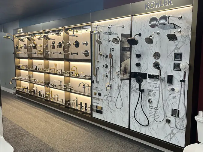 Wall of Kohler faucets and fittings at the McDonald Supply Showroom